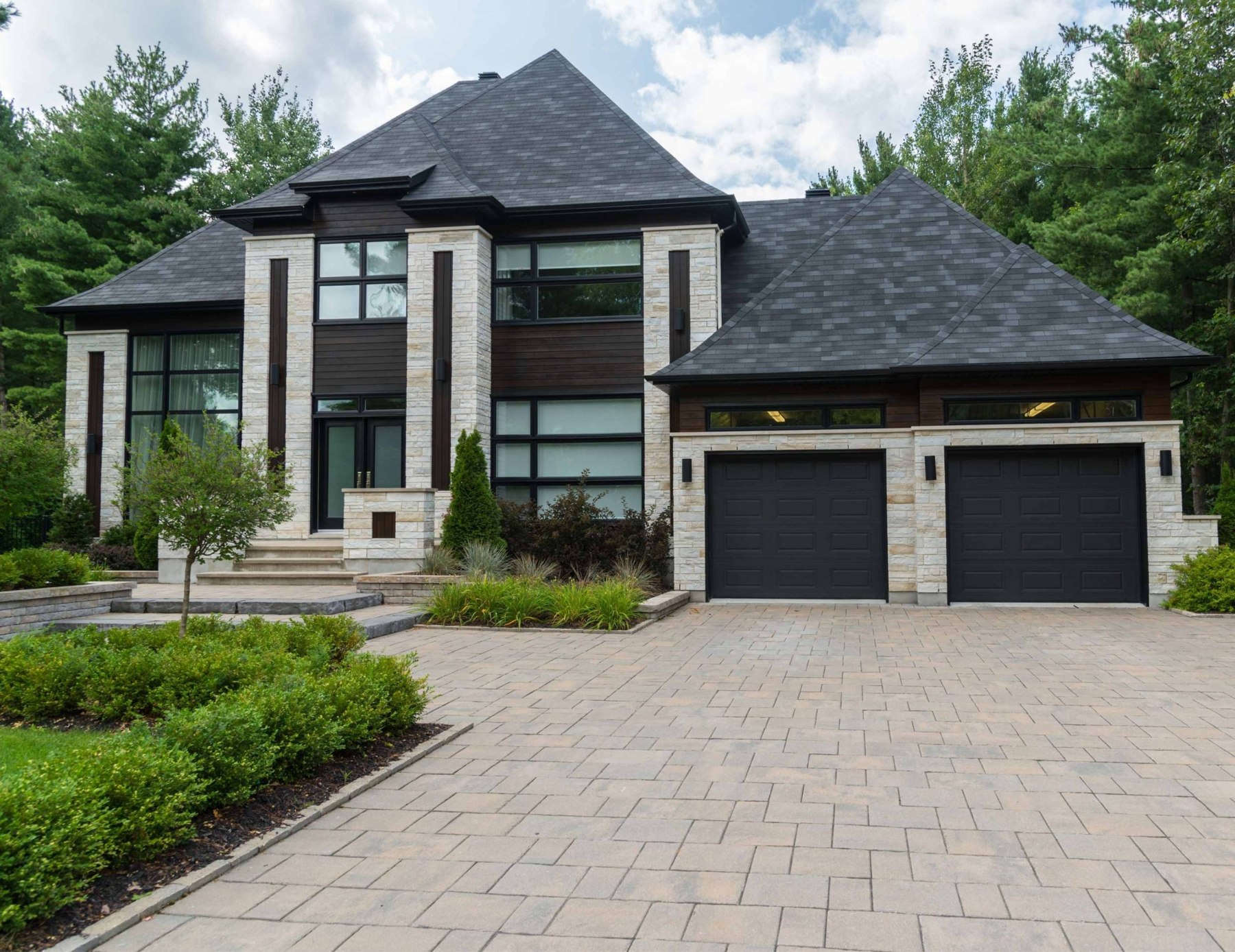 Home exterior with a landscaped front garden and driveway